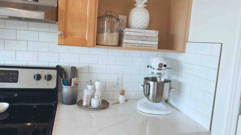 Kitchen aid mixer, Vitamix Blender, Instant Pot and a selection of cookbooks 