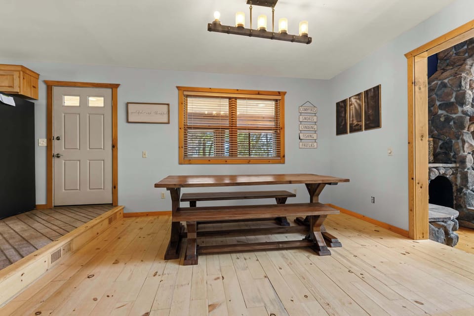 Charming picnic-style dining table perfect for large family gatherings and meals with a view.