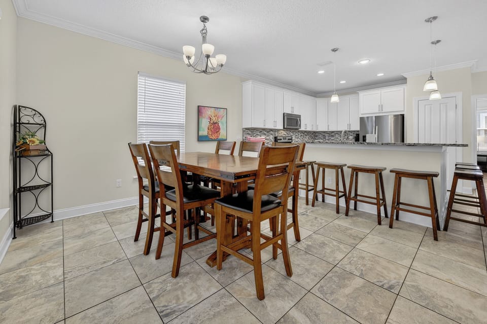 Dining room table with seating for 7. Additional 7 seats at the bar. 