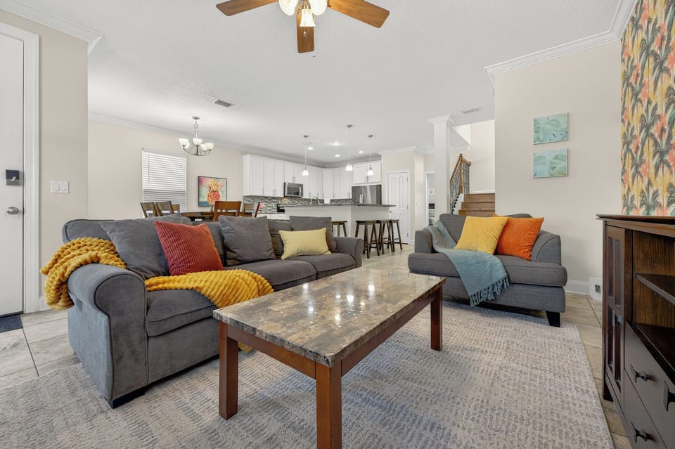 Living room with the dining room and kitchen in the distance.