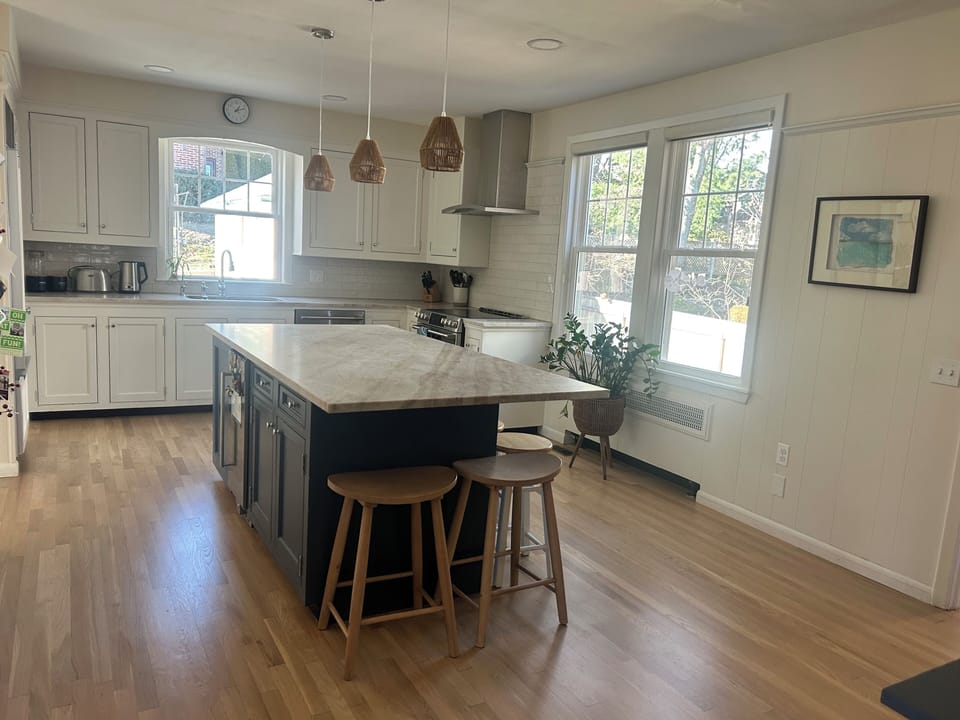 Kitchen with seating for 6 at the island and beverage fridge