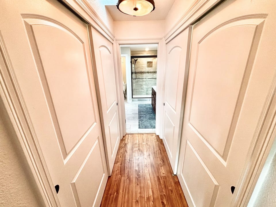His and her’s closet in the master bedroom leading to large master bath