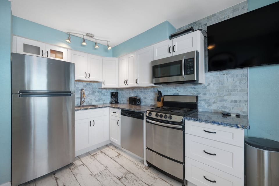 New open kitchen with stainless appliances