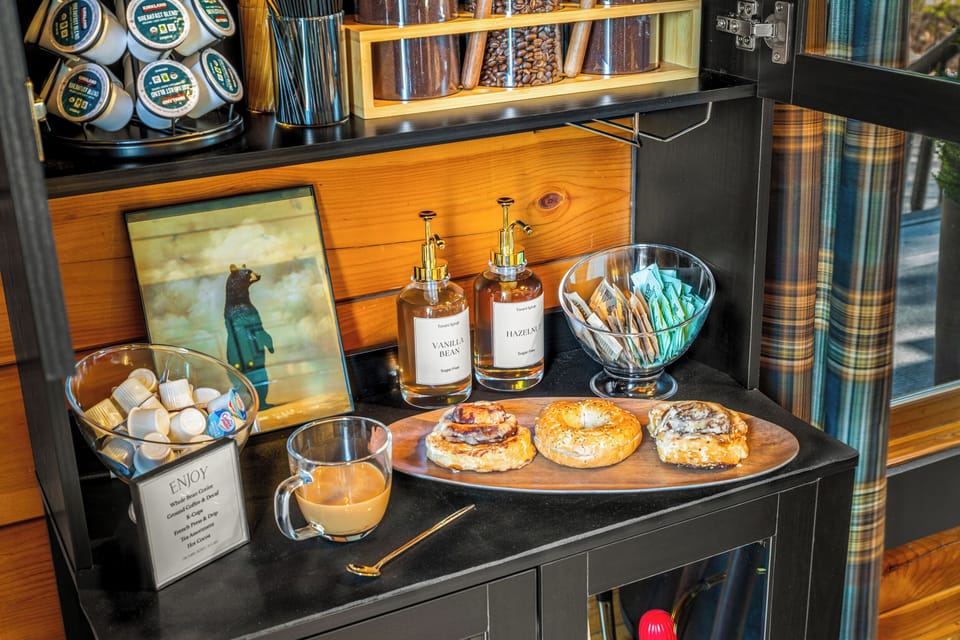 Coffee bar also includes creamers, sugars, honey, syrups.