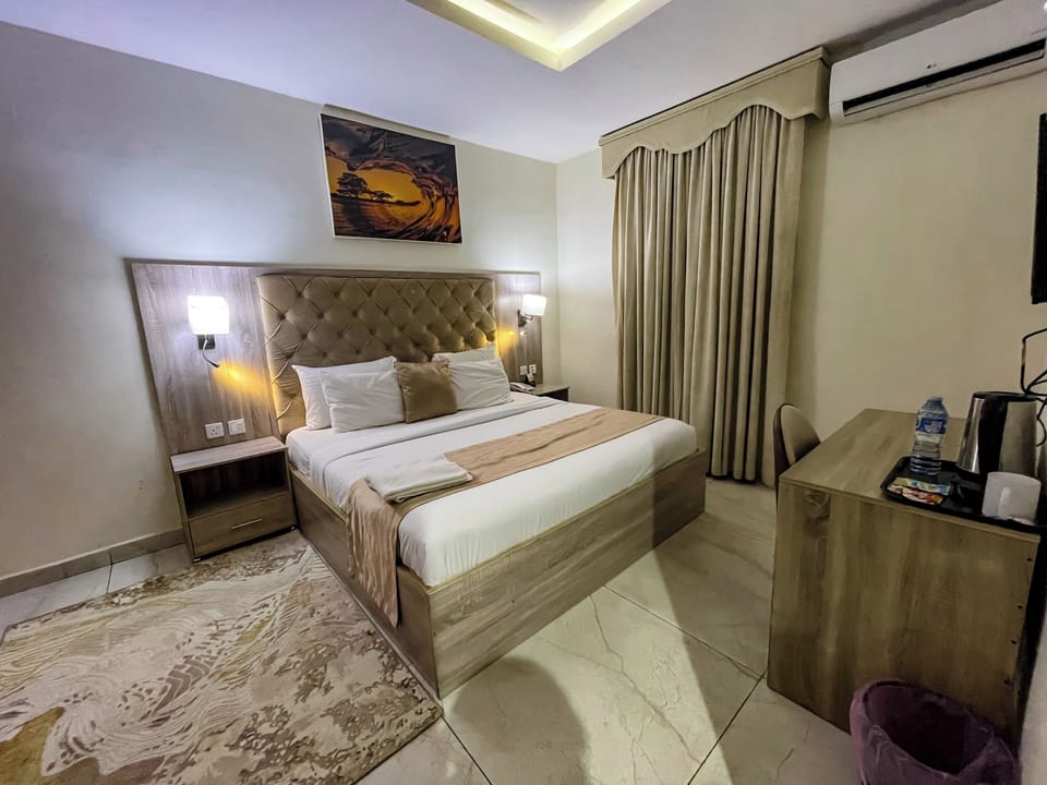 Deluxe Room, Garden View | In-room safe, desk, laptop workspace, blackout drapes