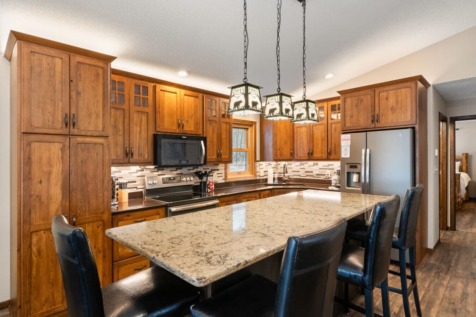 Our kitchen is fully stocked with all of the kitchen essentials! The island can seat 4 where the dining room seats 6.
