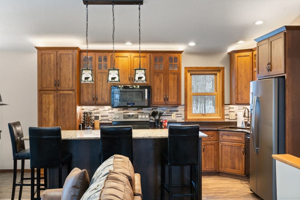 Our kitchen is fully stocked with all of the kitchen essentials! The island can seat 4 where the dining room seats 6.