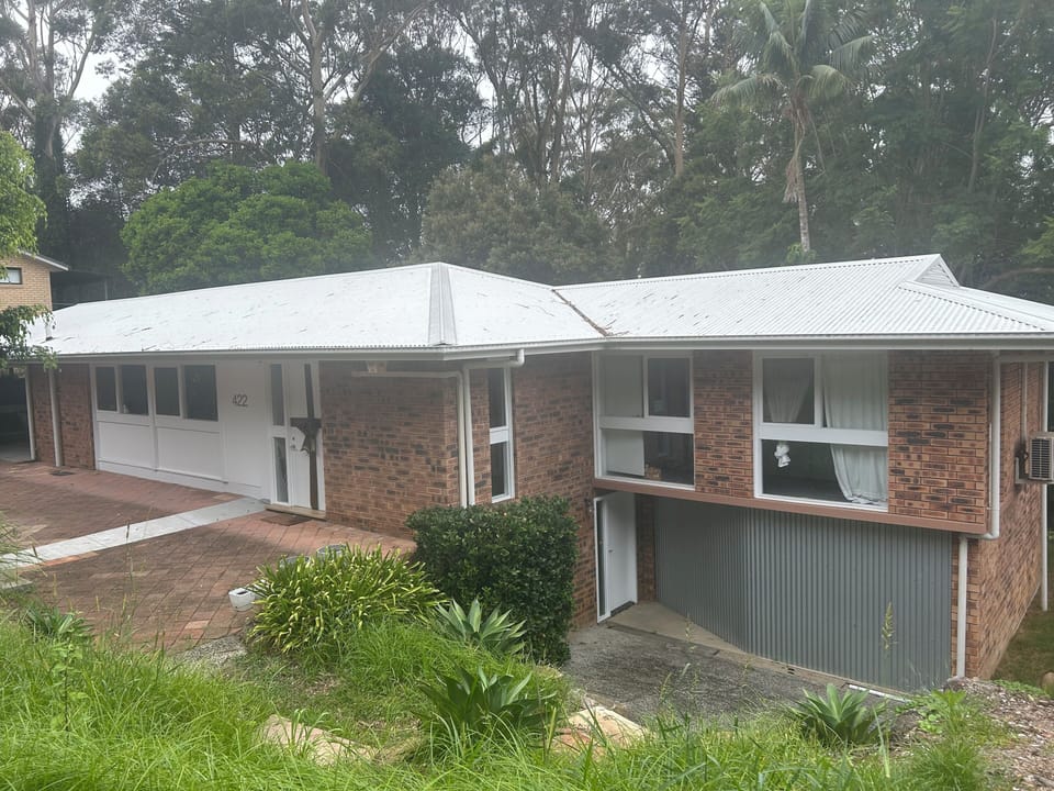 Exterior of House with the separate entryway to the Guest residence downstairs