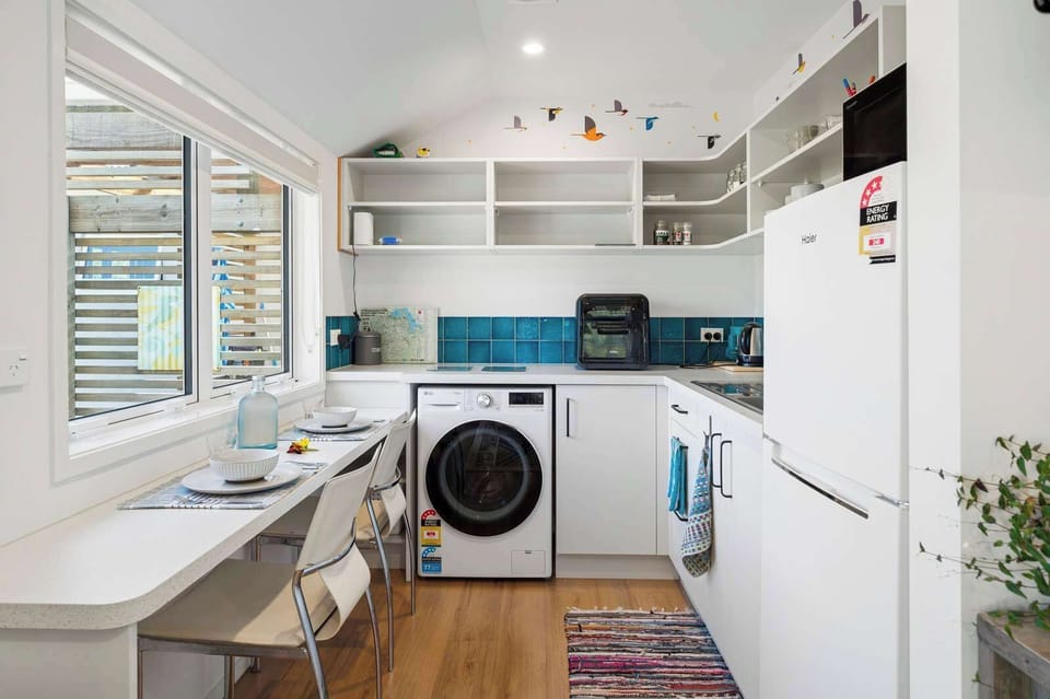 The unit has a kitchenette to make basic meals plus a washing machine.