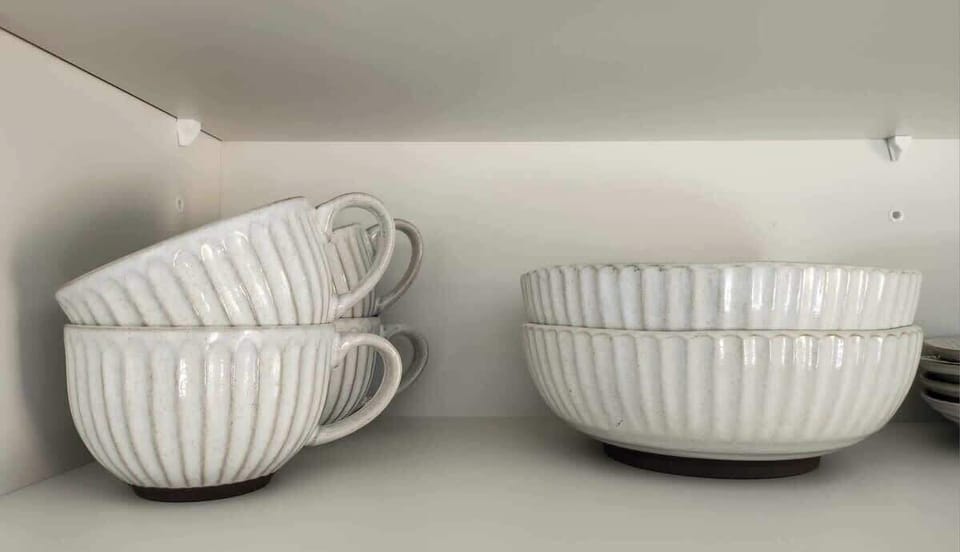 Bowls and mugs for basic meals.