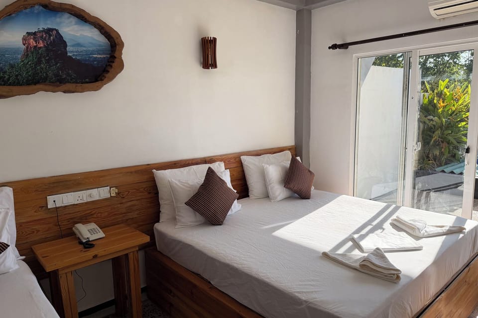 Comfort Quadruple Room, Garden View | Desk, laptop workspace, iron/ironing board, free WiFi