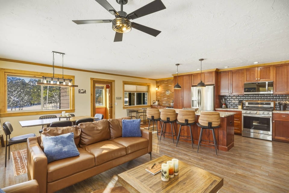 Leisure Lodge is a beautiful family friendly fun house that sleeps 8- amazing gaming room, pool table, hot tub & prime location! Pets welcome!