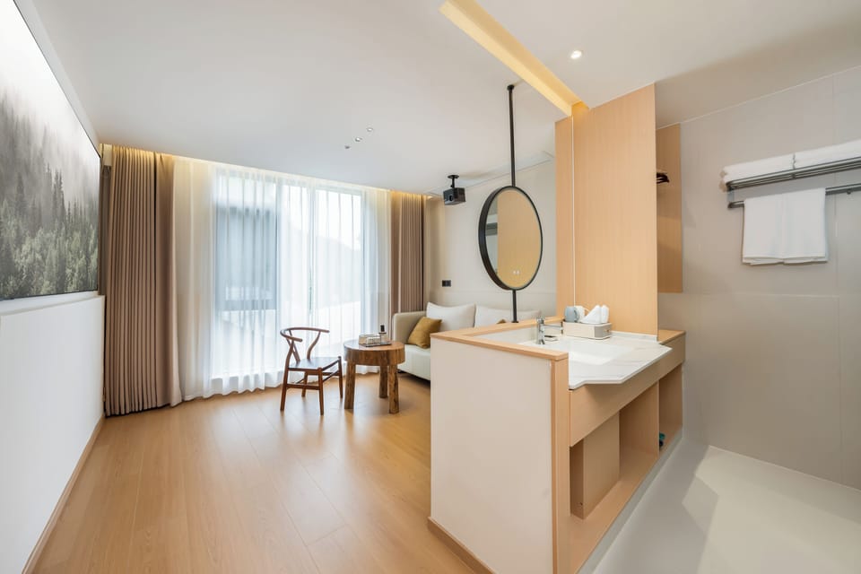 Luxury Suite, Courtyard View | Bathroom | Shower, rainfall showerhead, designer toiletries, hair dryer