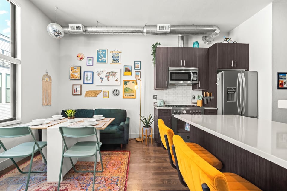 Stylish bar seating and kitchen details creating a warm, welcoming atmosphere here