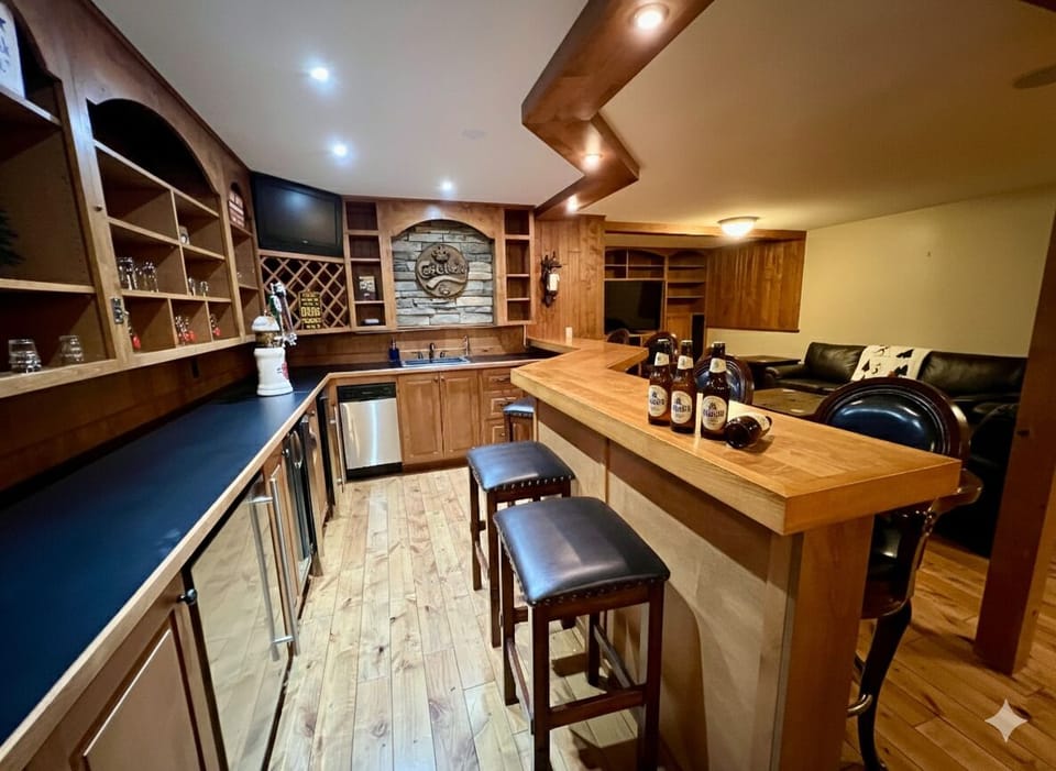 Lower level Rec Room. Extra dining (Games table), Wet Bar, TV, Family Room.