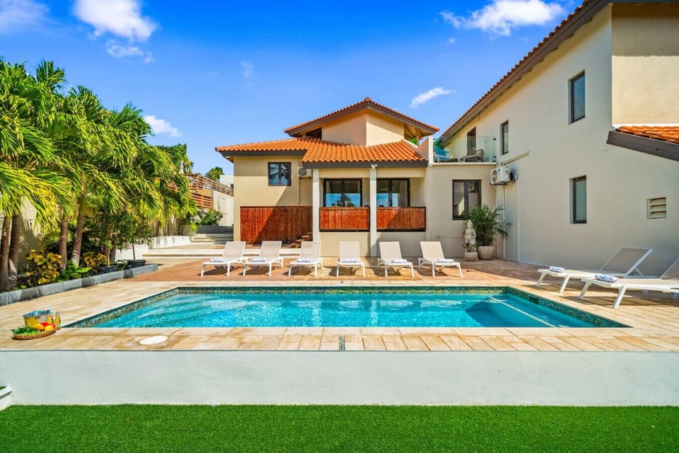 Sun soaked private pool with loungers perfect for Aruba family getaways