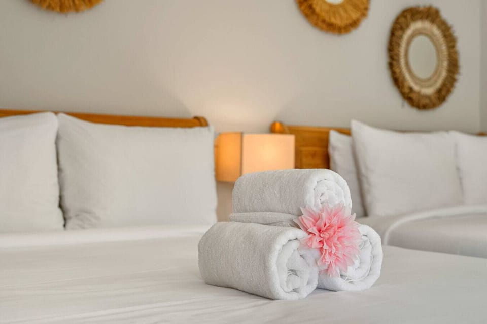 Soft linens and cozy bedroom details in Aruba