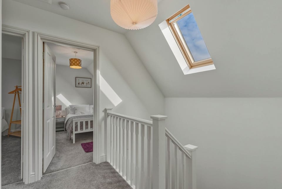 Easy-access stairwell leading to bathroom and bedrooms on the first floor