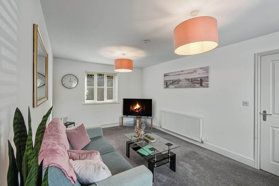 Stream, scroll or relax in this calm and comfy living area