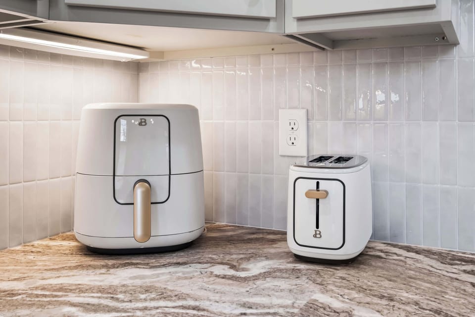Kitchen: Bright, clean kitchen with modern appliances, ample counter space, and a fresh, welcoming feel.