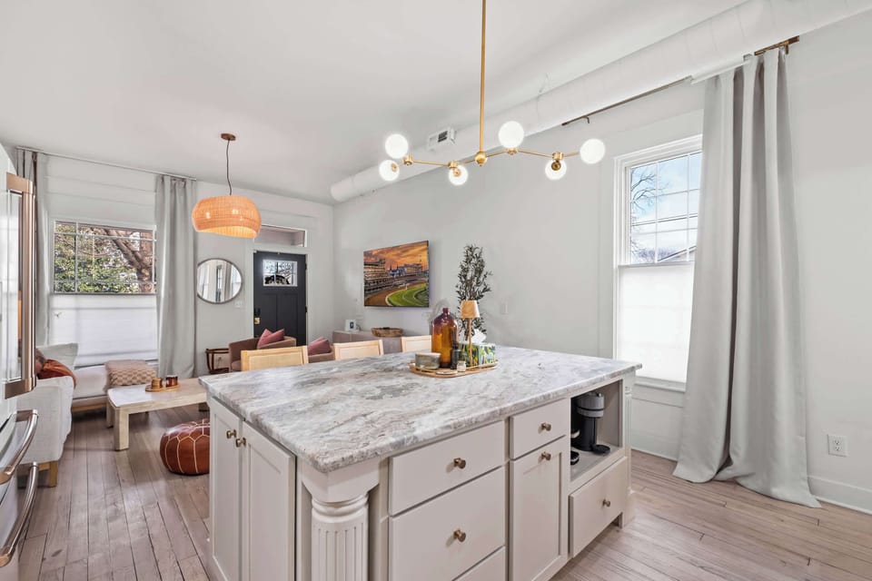 Kitchen: Bright, clean kitchen with modern appliances, ample counter space, and a fresh, welcoming feel.