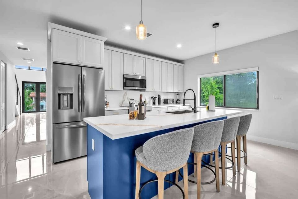 Both units feature spacious modern kitchen with a large island, plenty of storage, and all the essentials to cook your favorite meals during your stay.