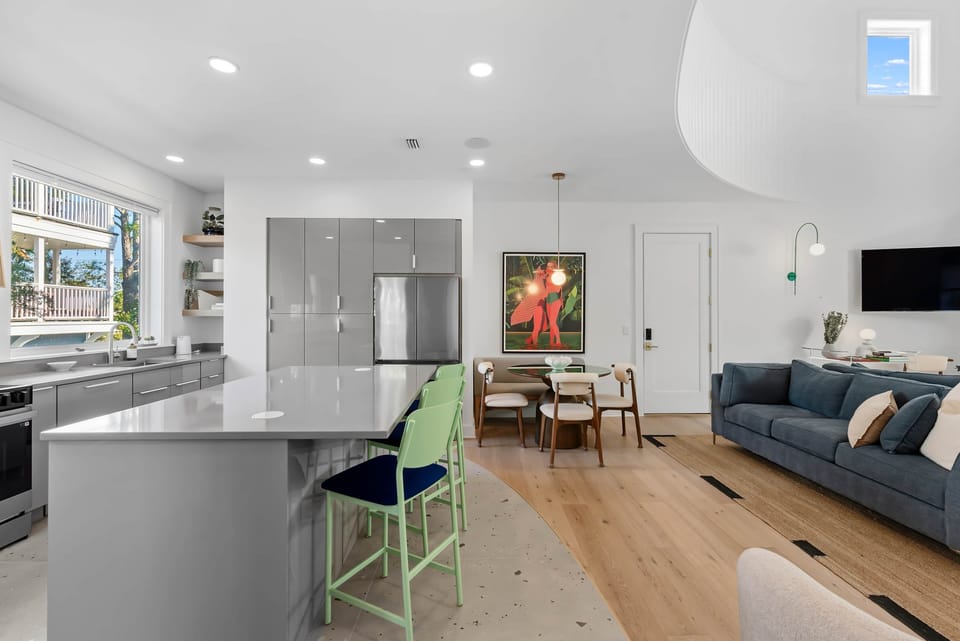 Open-concept kitchen and living area designed for gathering, entertaining, and comfort