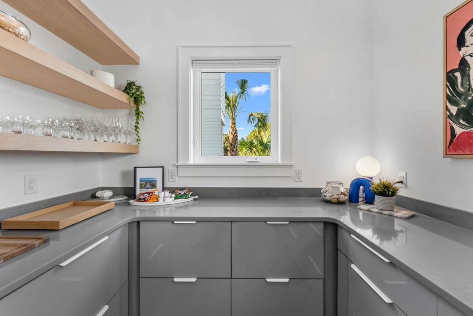 Kitchen open shelving with natural light and thoughtfully designed storage
