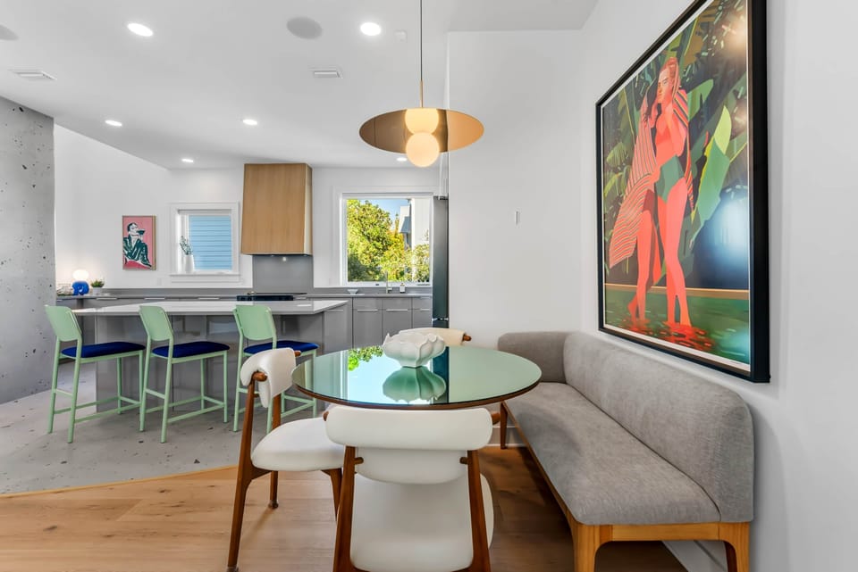 Kitchen and dining area with statement lighting and seating for family meals