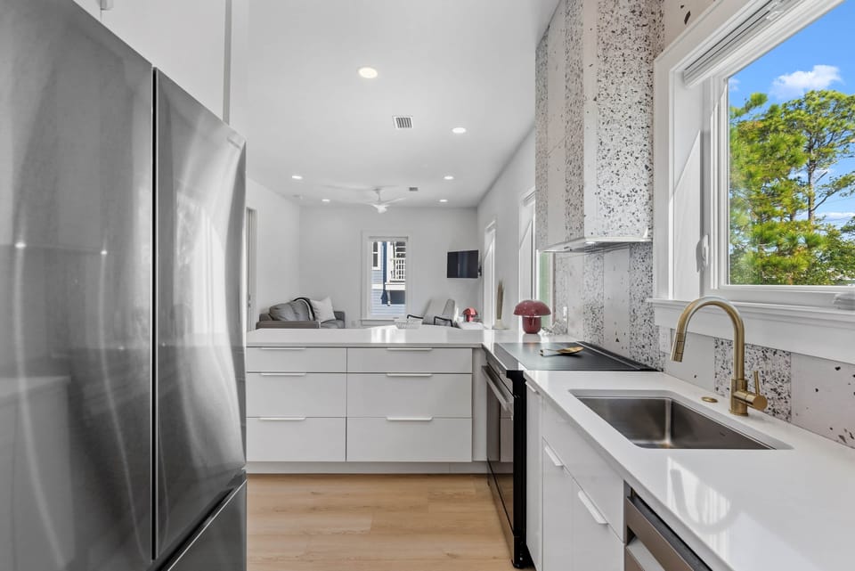Open kitchen design with clean lines, modern finishes, and efficient layout