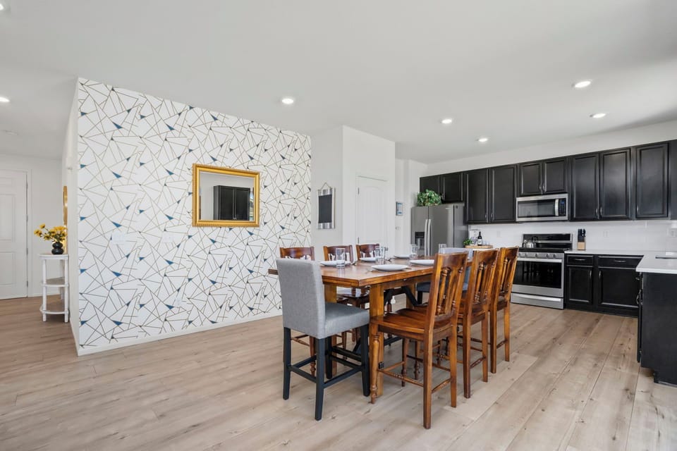 Gather around your stylish dining table for memorable meals, with a fully equipped kitchen ready for your culinary adventures.