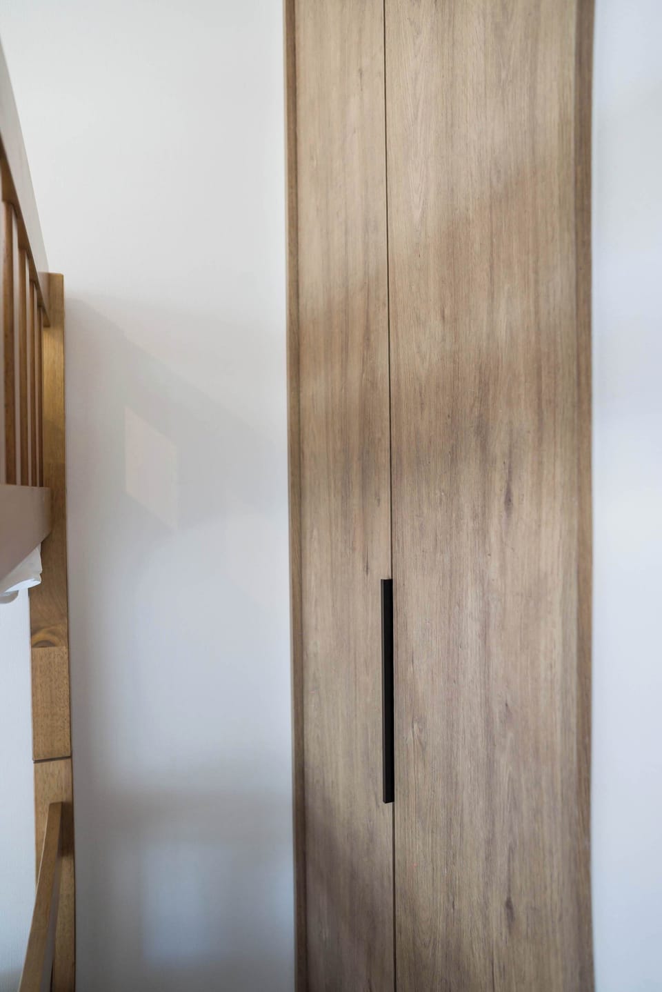 Stylish wooden wardrobe adds a touch of elegance and functionality to your stay.