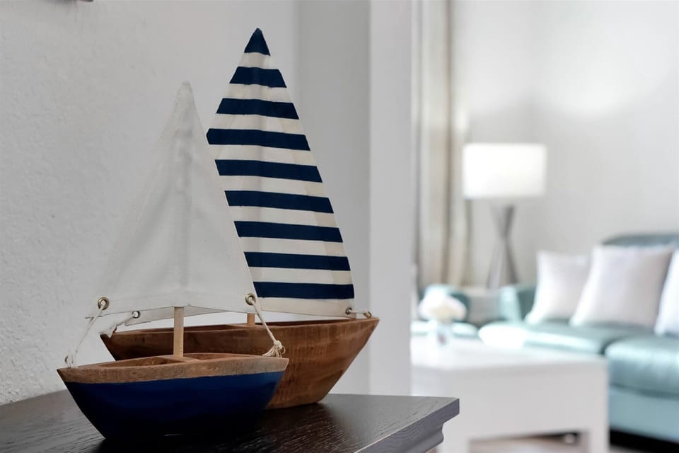 Charming nautical touches create a seaside atmosphere in your bright, comfortable living space with coastal-inspired decor.