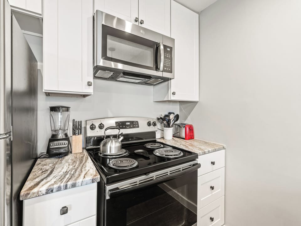 Your fully equipped kitchen features stainless steel appliances and marble countertops, perfect for preparing meals during your stay.