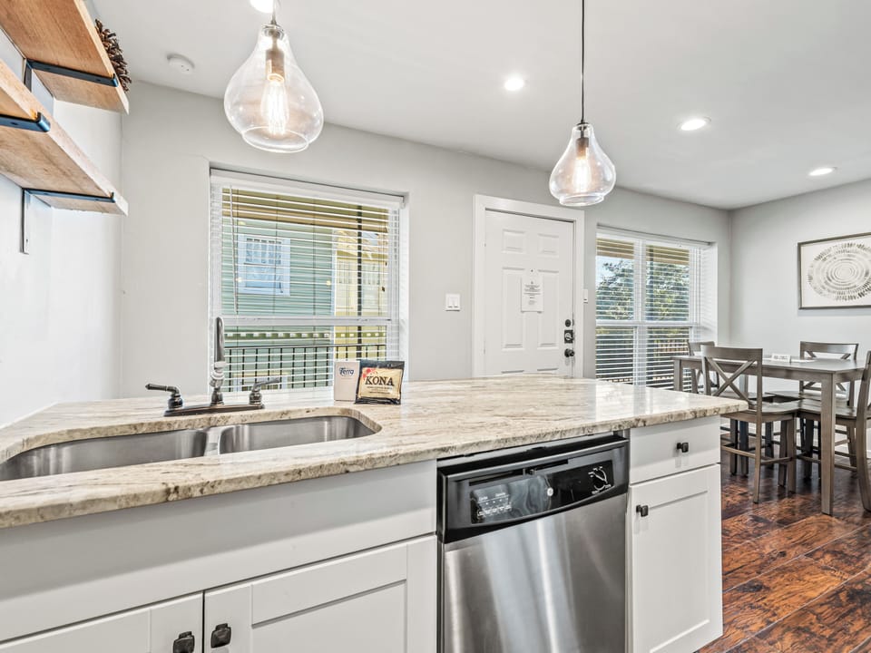 Your gourmet kitchen features granite countertops, stainless appliances, and elegant pendant lighting for memorable meal prep.
