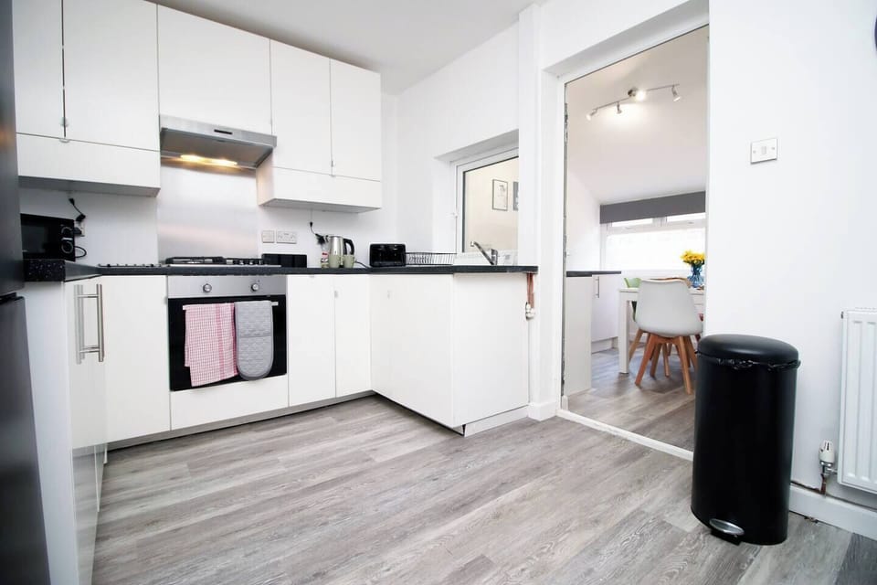 The fully equipped kitchen is ready for your culinary adventures, with everything you need to make delicious homemade meals. 