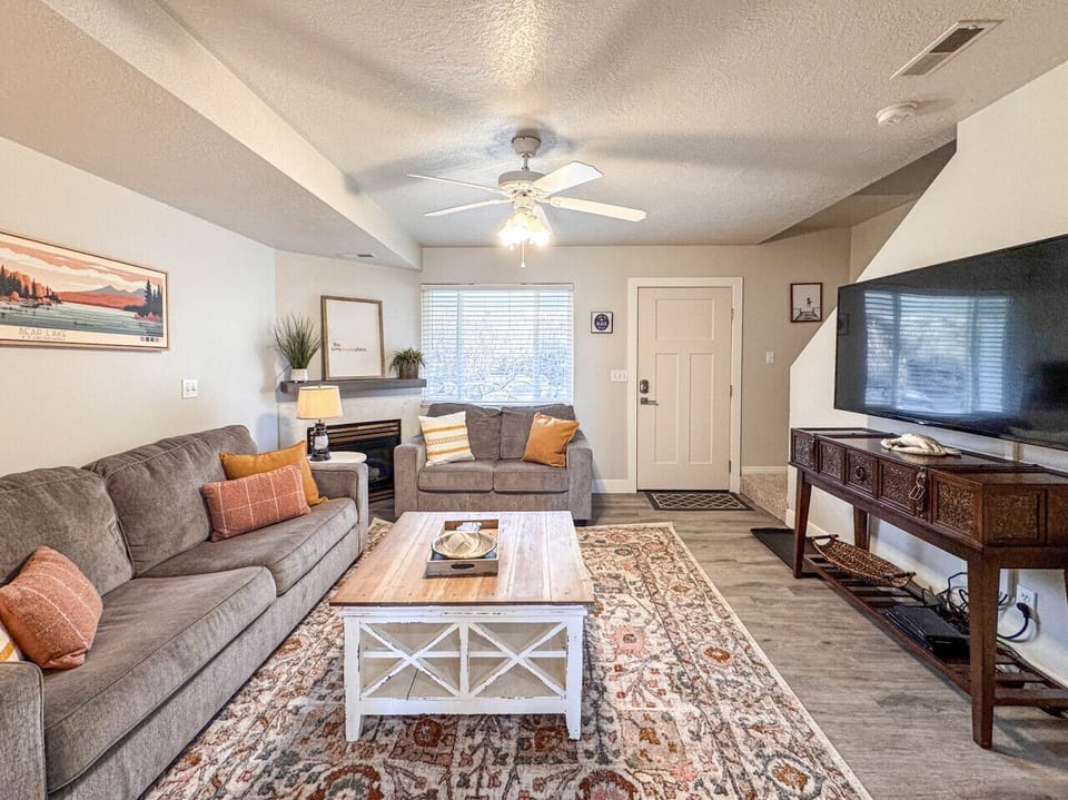 Bright, cozy living room offering relaxed comfort, warm accents, and the perfect space to unwind together.