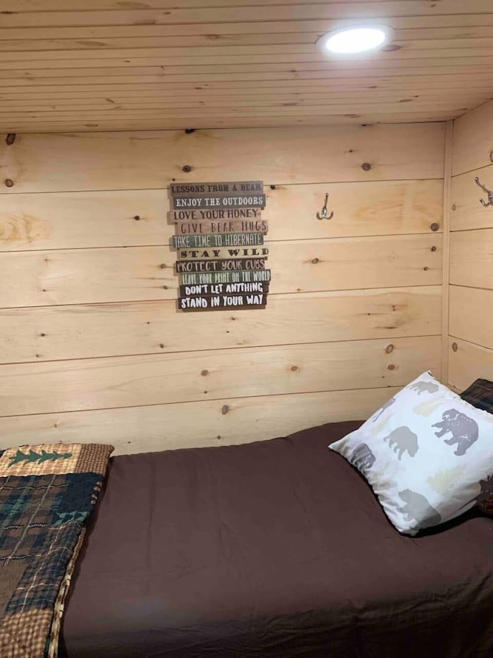 The `Bear Den` has 2 twin beds.  The room is rearranged for more floor space, but this picture accurately shows both beds, new carpet, and decorative wall.