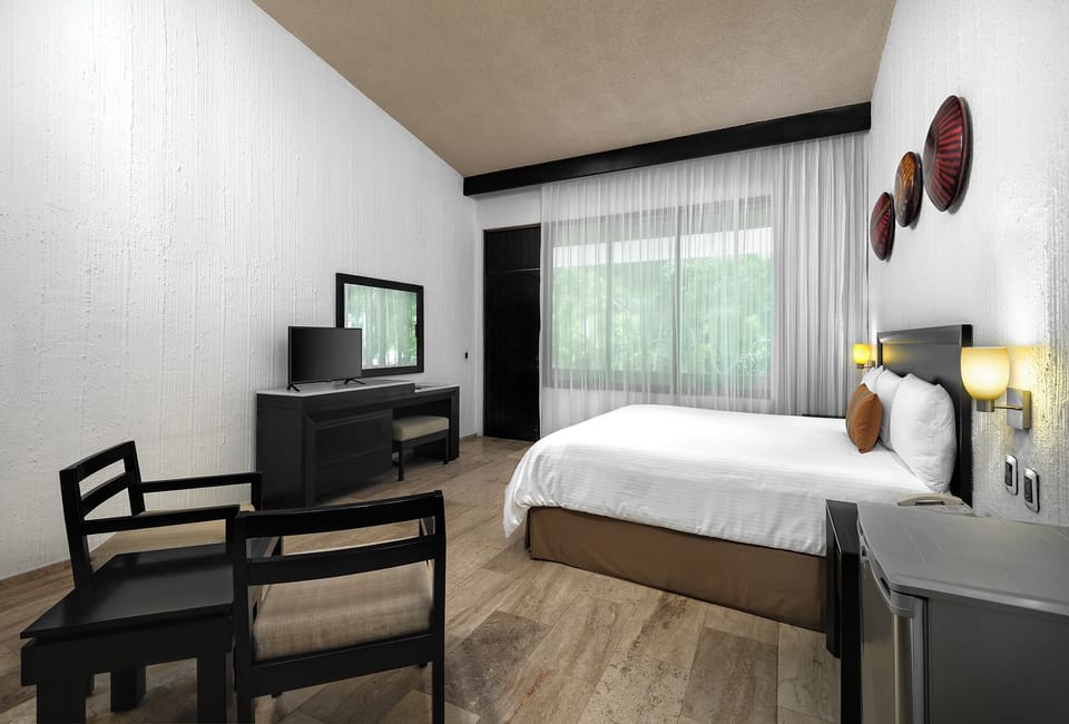 One Bedroom Suite | Down comforters, in-room safe, iron/ironing board, bed sheets