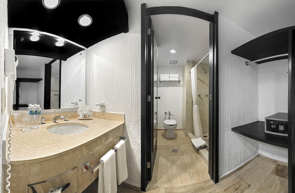 Shower, rainfall showerhead, hair dryer, towels
