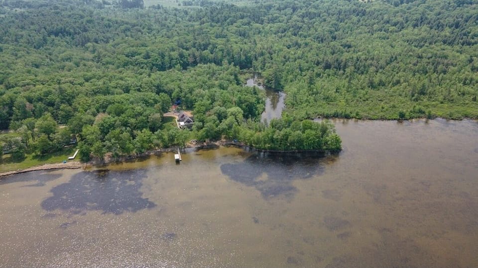 838 feet of shoreline wraps this peaceful property
