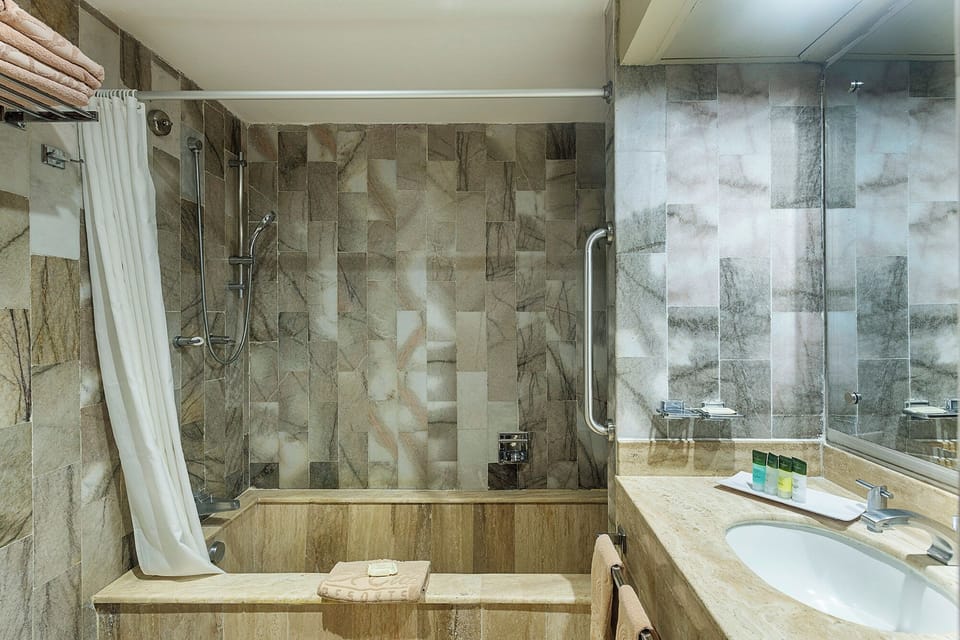 Shower, rainfall showerhead, designer toiletries, hair dryer