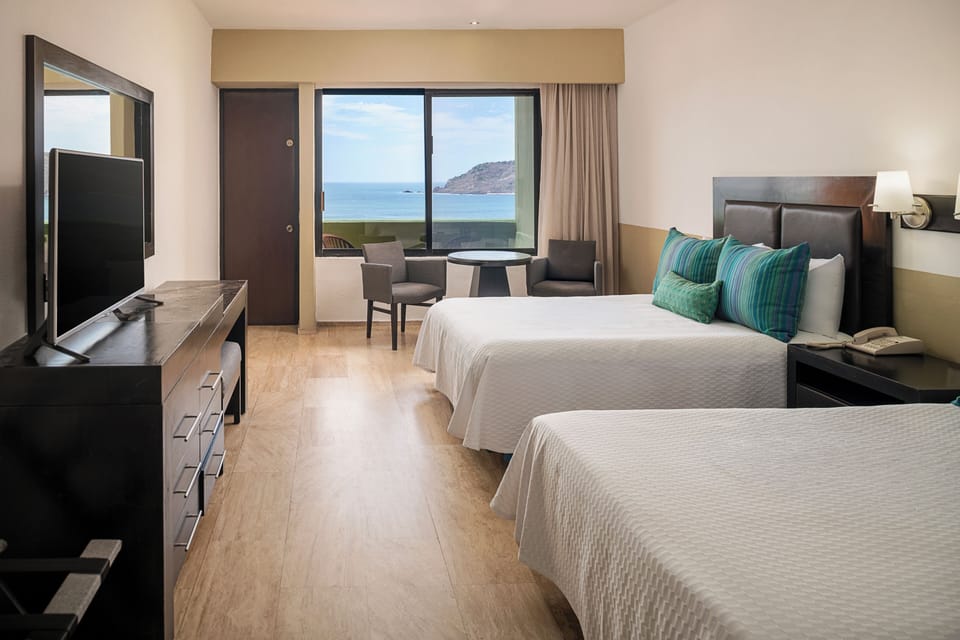 Standard Ocean View | Premium bedding, down comforters, in-room safe, iron/ironing board