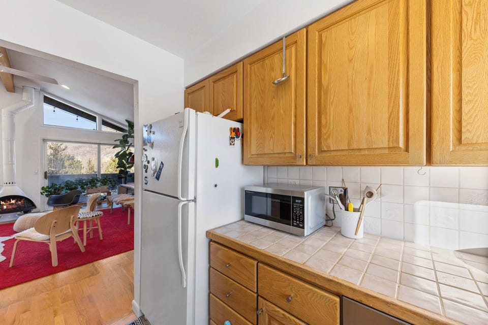 Kitchen. bright, compact, Double sink with a window view  and kitchen essentials