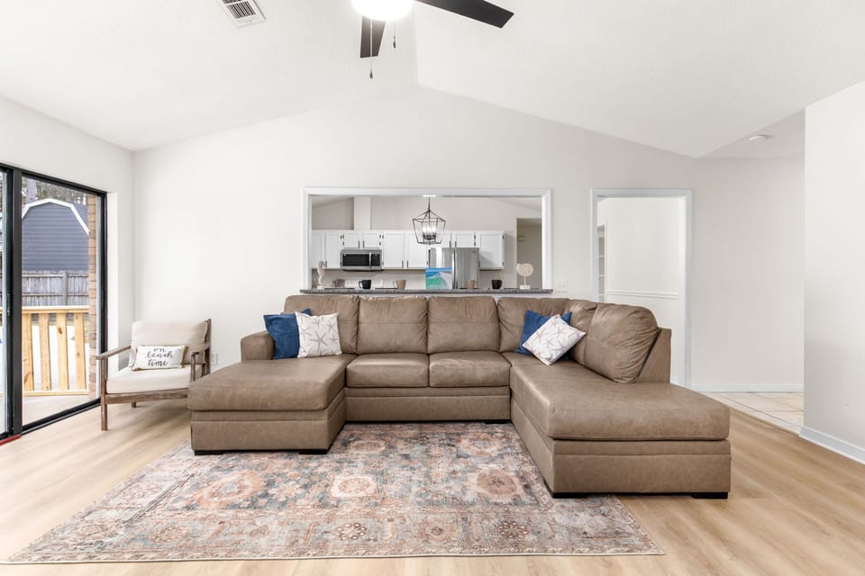 New comfy big couches, with lots of room for everyone to spread out, or step out the sliding glass doors to the pool 