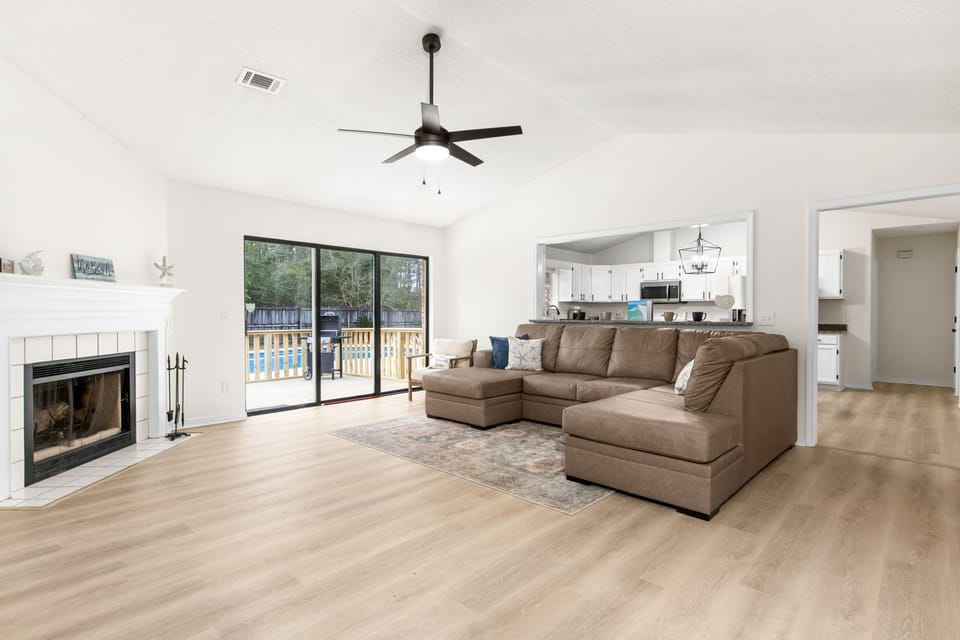 Open Living Space with Pool Views | Brand New Furnishings | Fireplace & Indoor-Outdoor Flow