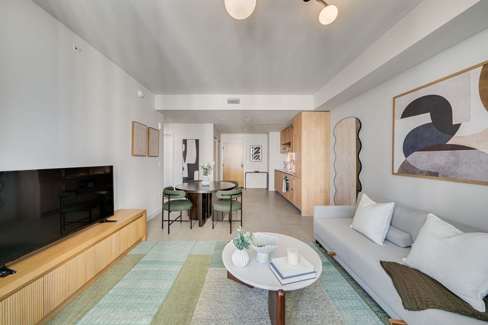Open living area with smart TV and dining space