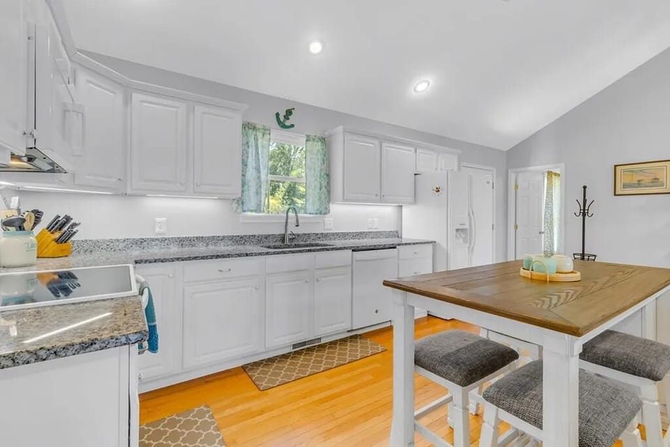 Well stocked kitchen with dishwasher, 2 refrigerators, electric oven and stove