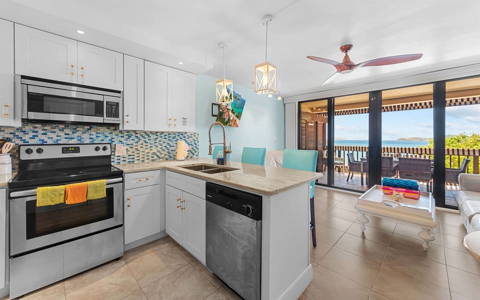 Well appointed kitchen opens to the living room and gorgeous views
