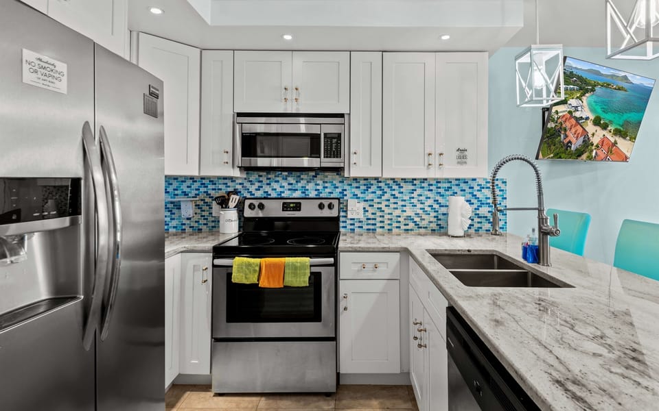 Full size refrigerator, cooktop, oven and dishwasher in this beautifully renovated kitchen
